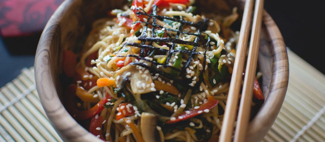 Pan-fried noodles with tomatoes, and sesame seeds